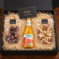 Grosse Geschenkbox von Andre’s Superfood mit 100 g Erdbeeren im Schokomantel, 100 g Premium-Nussmischung und Biotta Mango Mix – Weihnachtsgeschenk für Mitarbeitende und Kunden.
